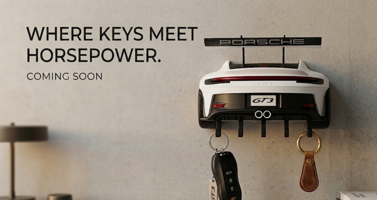 Porsche car key holder with keys on a neutral background